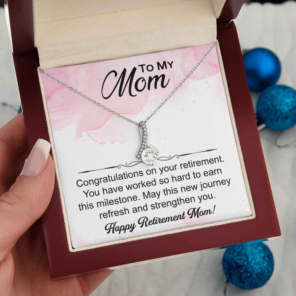 Love Knot necklace in a box with a heartfelt "Mom's Retirement" message, symbolizing love, gratitude, and new beginnings