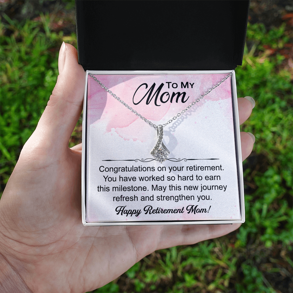 Love Knot necklace in a box with a heartfelt "Mom's Retirement" message, symbolizing love, gratitude, and new beginnings