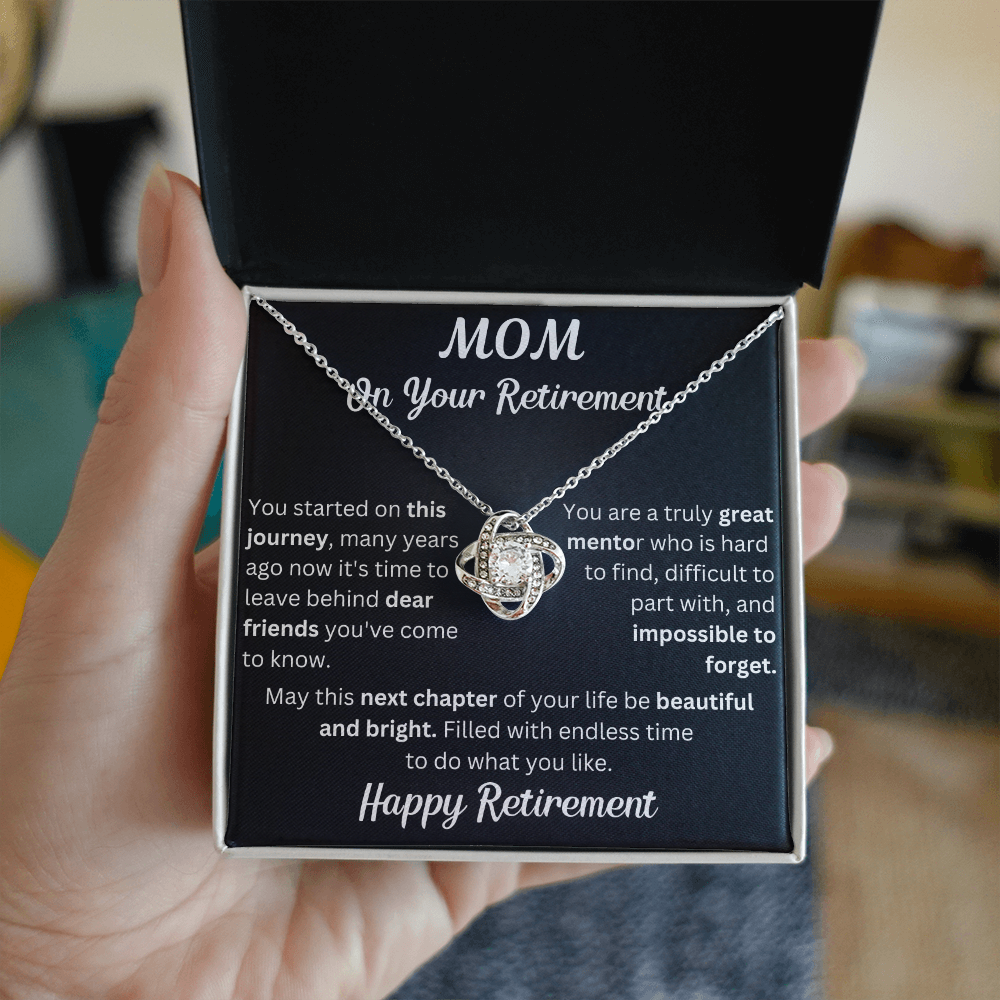 Love Knot necklace in a box with a heartfelt "Mom's Retirement" message, symbolizing love, gratitude, and new beginnings